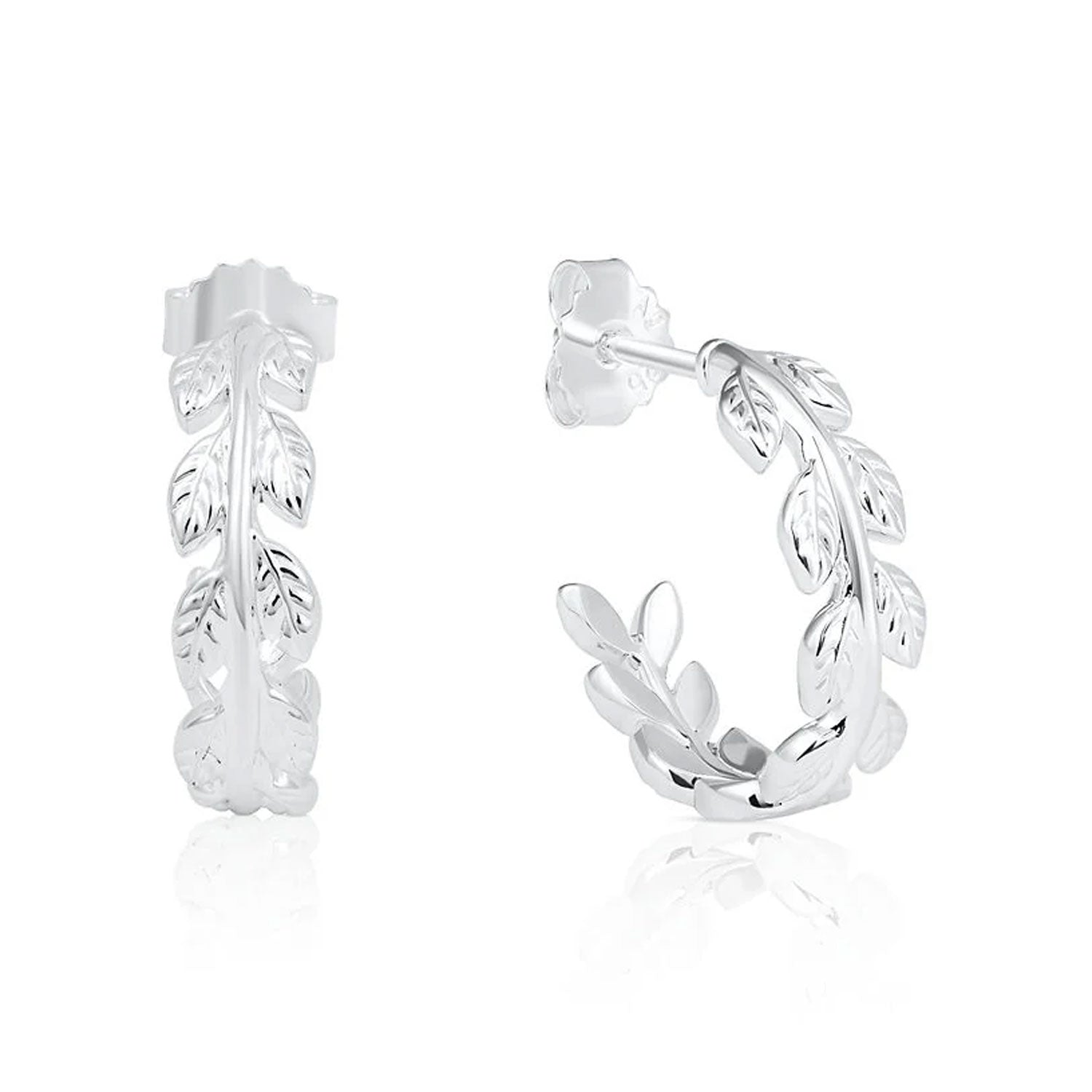 A pair of sterling silver huggie hoop earrings featuring a detailed leafy vine design, shown from the front and side on a clean white background with a subtle reflection.