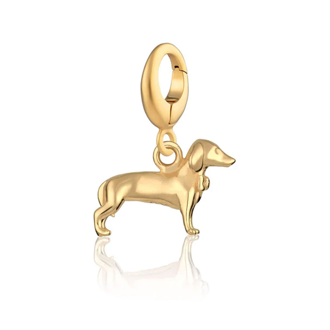 Gold dog-shaped pendant on a white background
