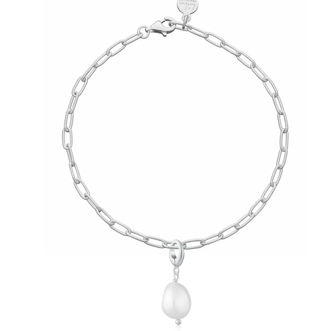 Silver chain bracelet with a pearl pendant on a white background