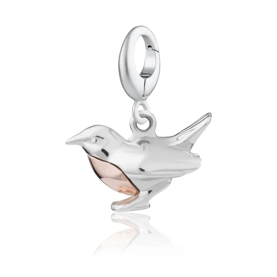 Silver and rose gold bird-shaped pendant on a white background