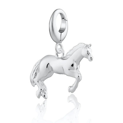 Silver horse charm on a white background