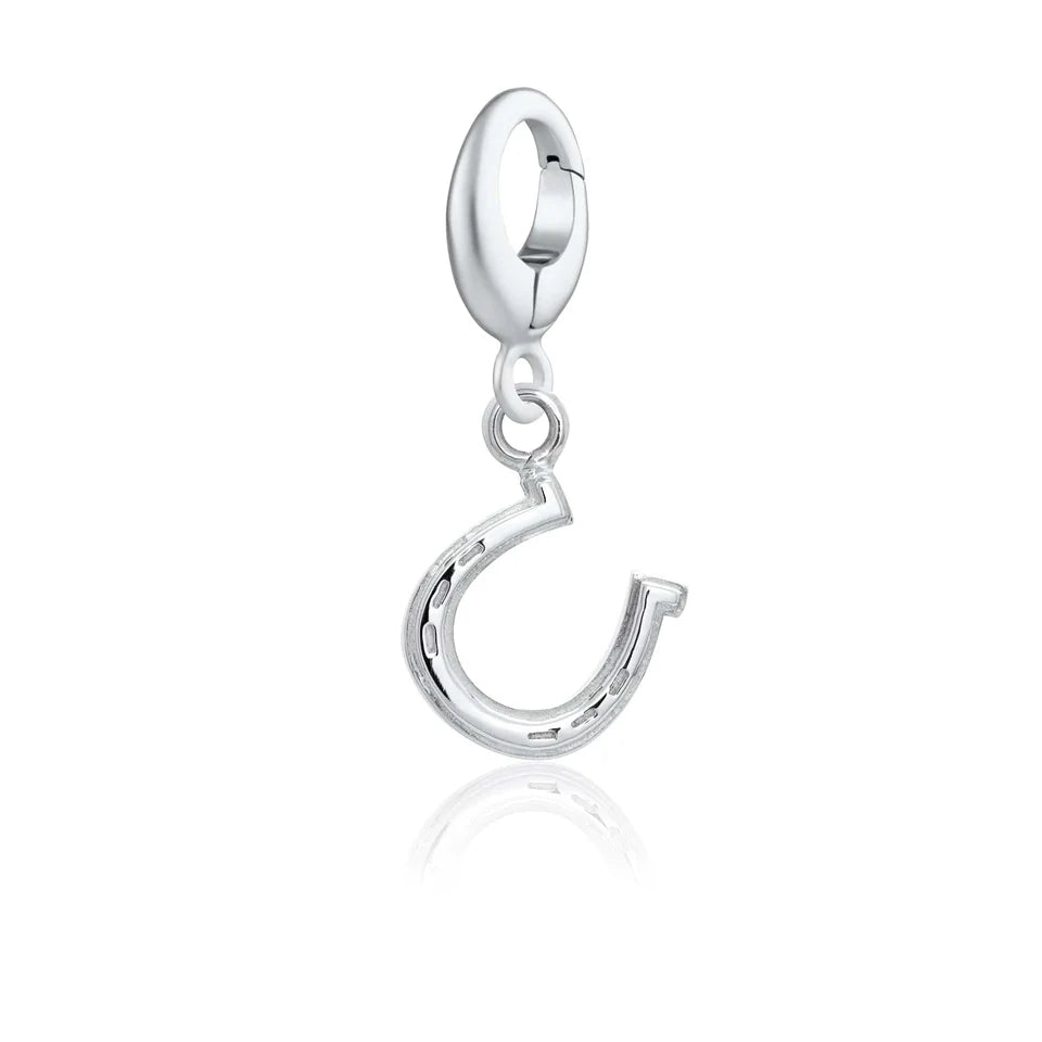 Silver charm with an equestrian design on a white background