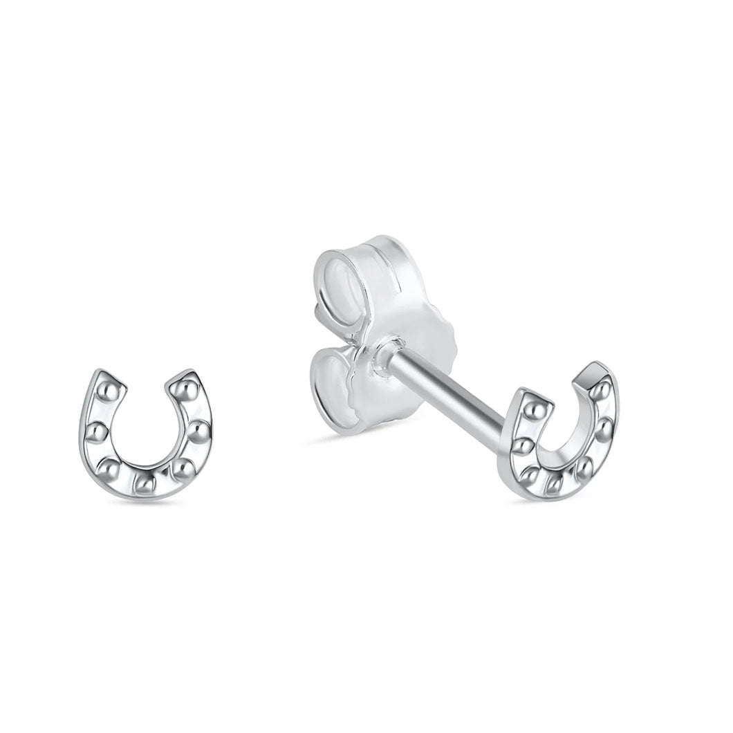 Mini horseshoe earrings on white background