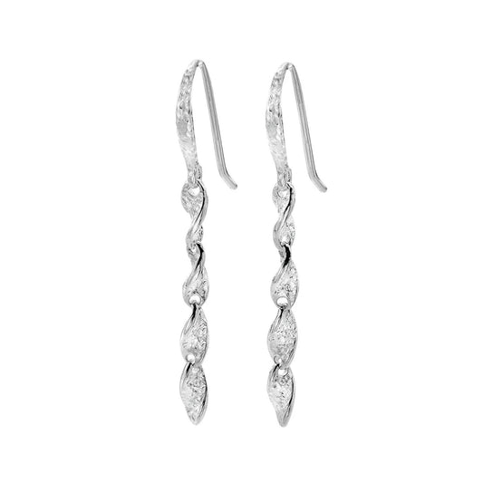 A pair of silver drop earrings with a twisted, wave-like segmented design, set with clear stones, on a plain white background.