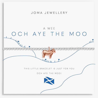 A Joma Jewellery bracelet card featuring a silver beaded bracelet with a small rose gold goat charm, displayed on a white card with blue text and line art.