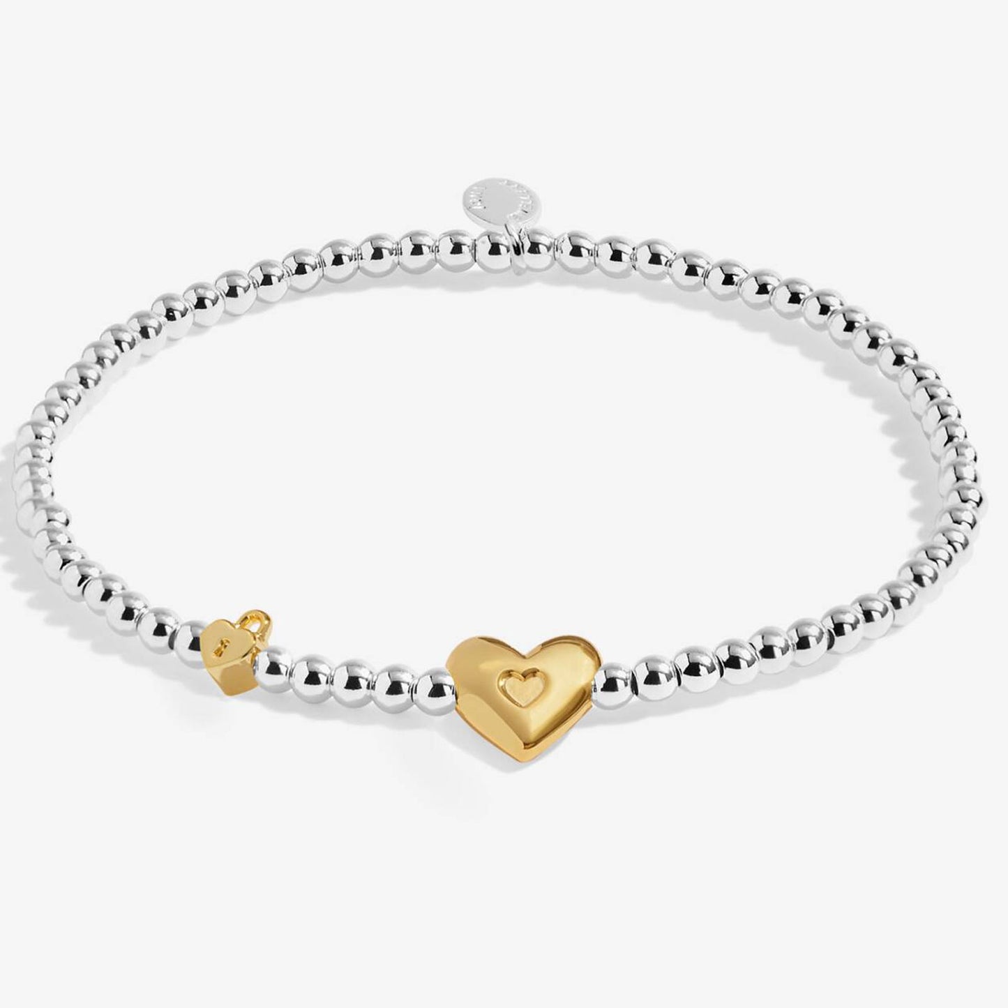 beaded bracelet with heart charm on white background