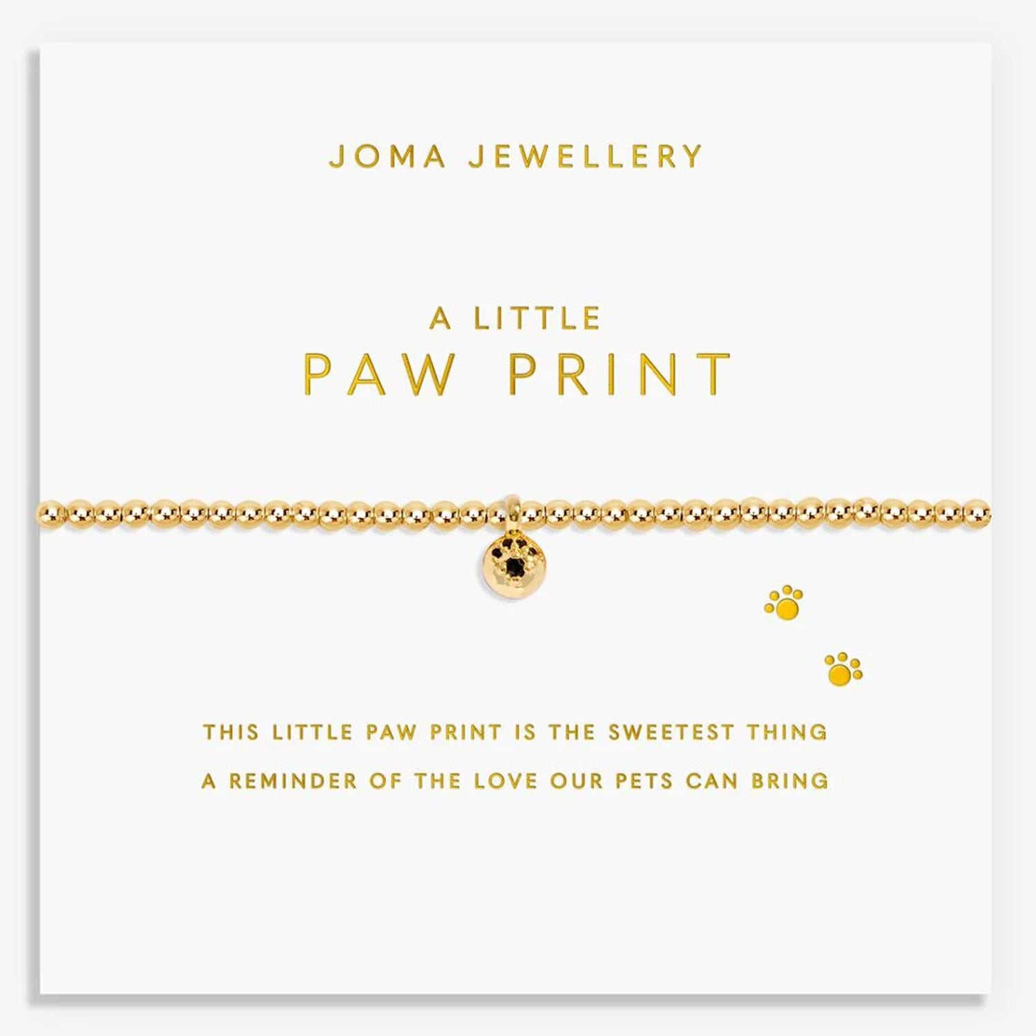 Gold bracelet with paw print charm on a Joma Jewellery card.