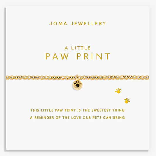 Gold bracelet with paw print charm on a Joma Jewellery card.