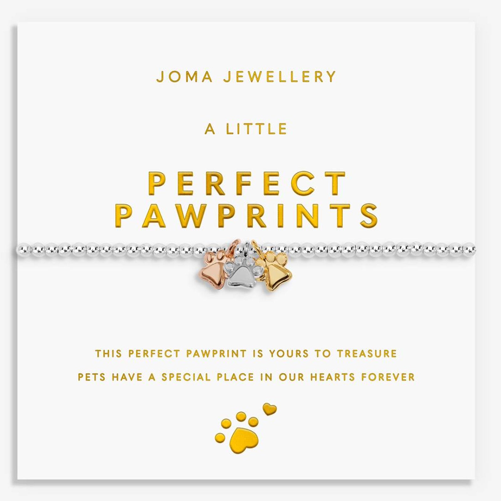 A silver chain bracelet with three paw print charms in gold, silver, and rose gold, displayed on a white Joma Jewellery card that reads 'A LITTLE PERFECT PAWPRINTS'.