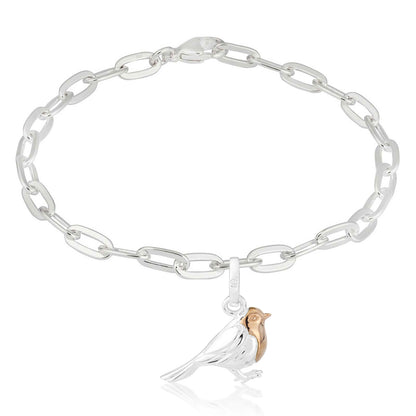 Silver chain bracelet with a bird charm on a white background