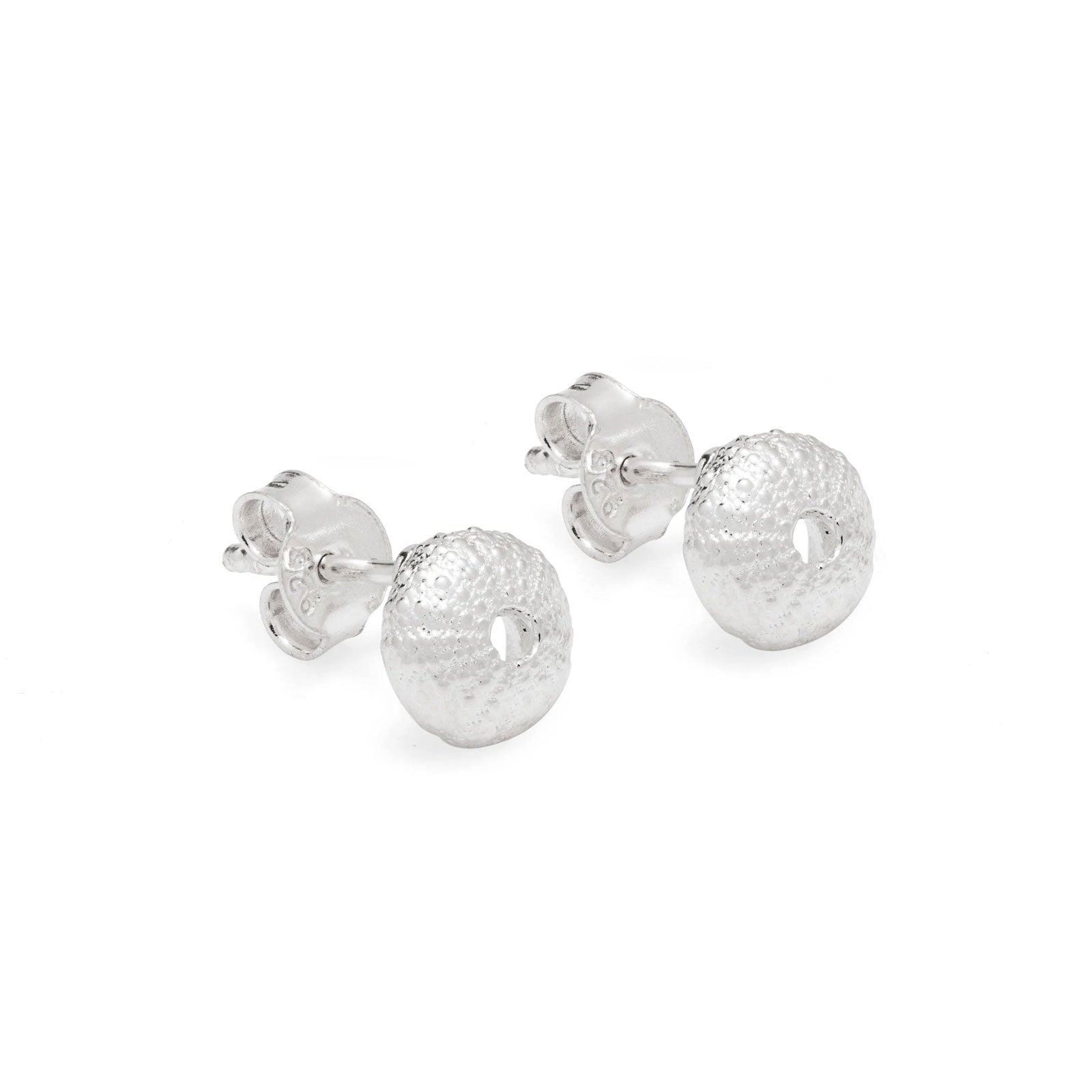 A pair of silver sea urchin stud earrings with textured, hammered circular dangles, shown on a clean white background.