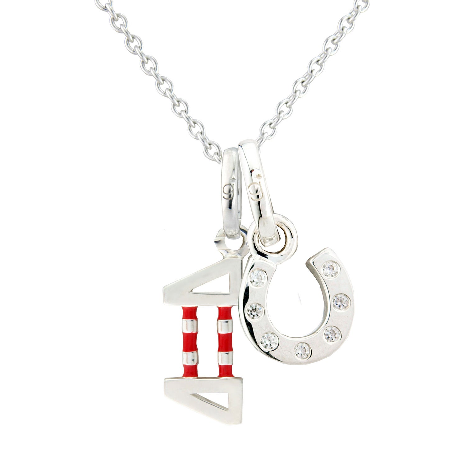 A silver necklace featuring a pendant show jump and a horseshoe adorned with small clear sparkly stones