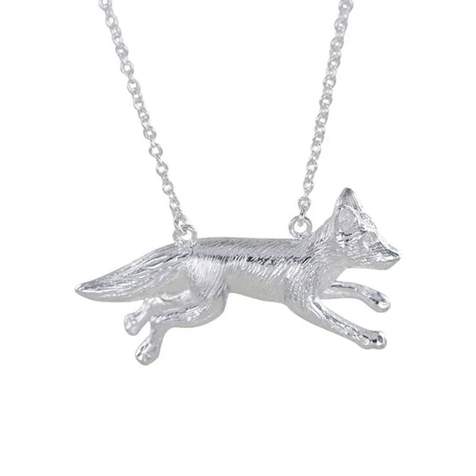 silver-fox-hanging-from-chain-on-white-background