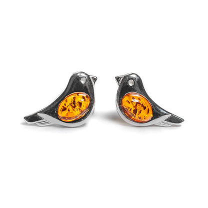Bird-shaped earrings with orange gemstones on a white background