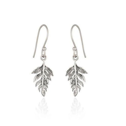 A pair of sterling silver leaf drop earrings with textured, antiqued detailing and fishhook wires, shown on a clean white background with a soft reflection below.