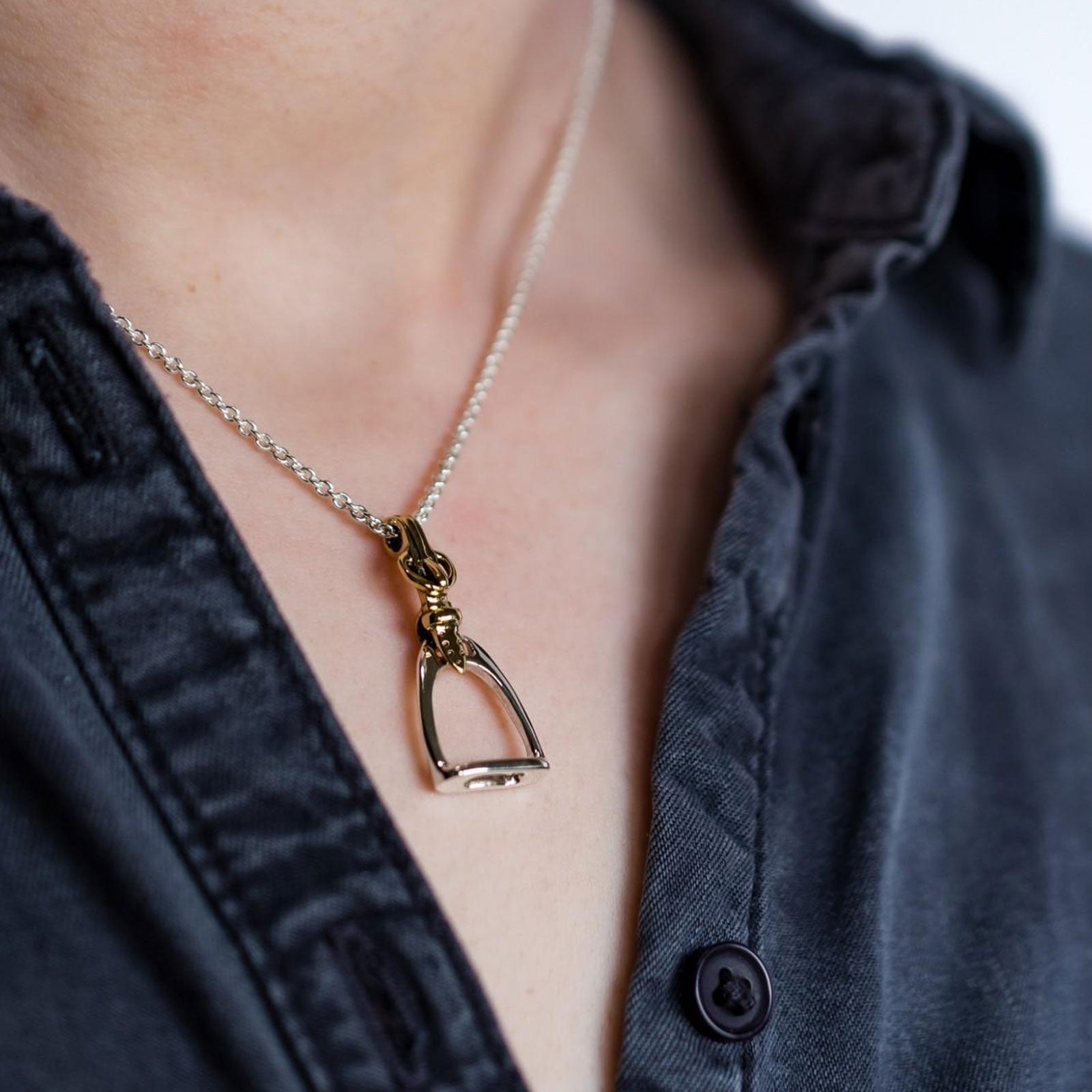 stirrup-necklace-hanging-from-a ladies-neck