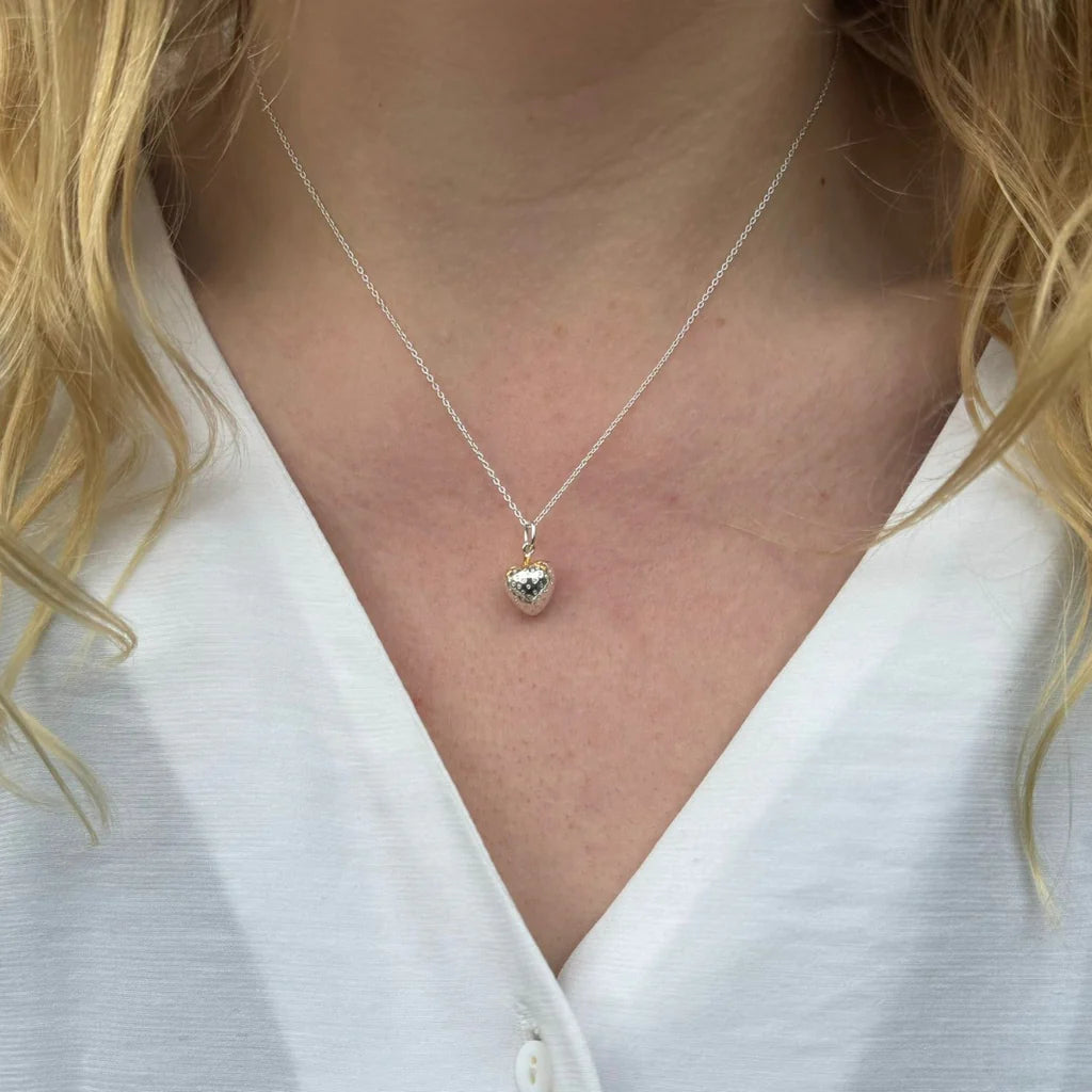strawberry necklace being worn around the neck