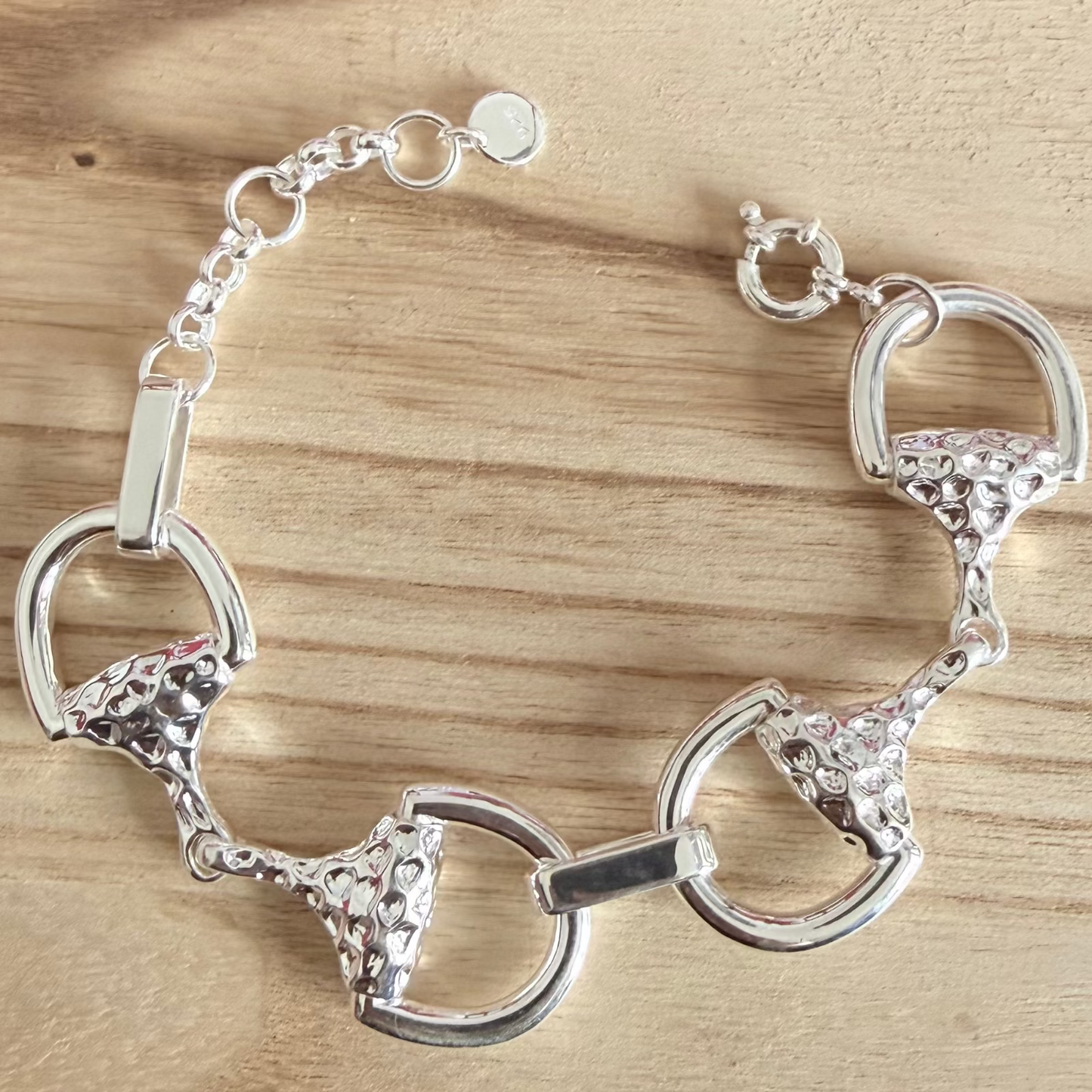 luxury snaffle sterling silver bracelet on wood