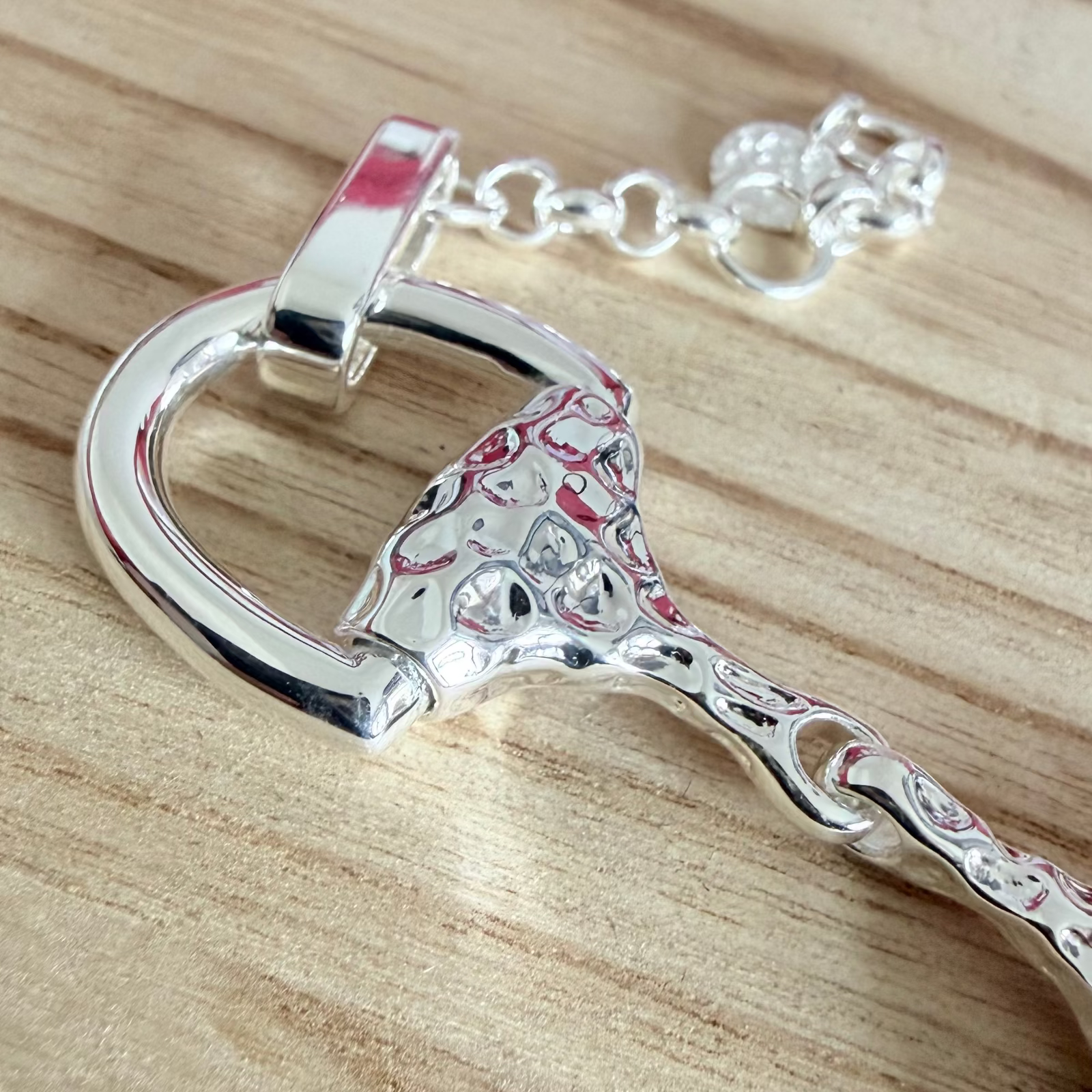 super size snaffle bracelet on wooden board