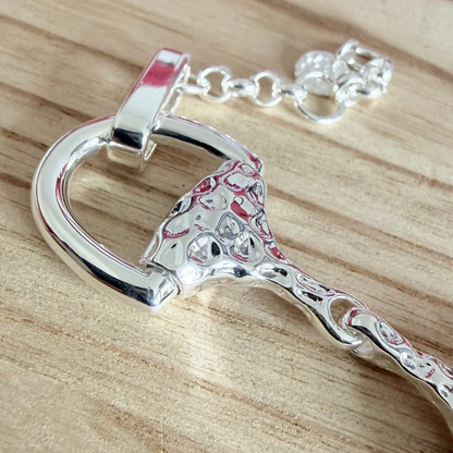 super size snaffle bracelet on wooden board