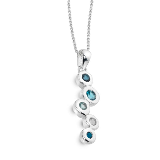 Silver necklace with blue gemstones on a white background