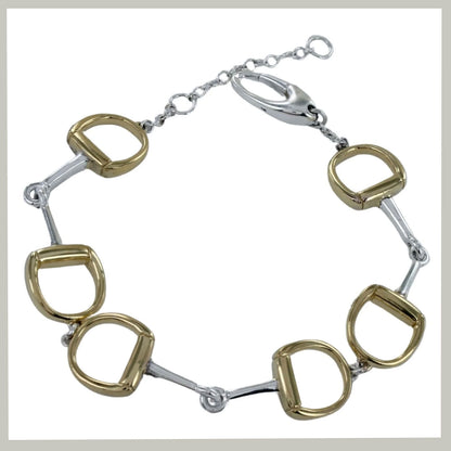 A horse-bit style bracelet featuring alternating gold and silver-toned horsebit links connected by a silver-toned chain with a lobster clasp, shown on a plain white background.