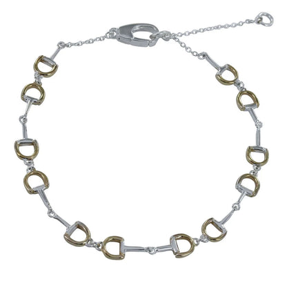 Bracelet with silver and gold horse bit links on a white background