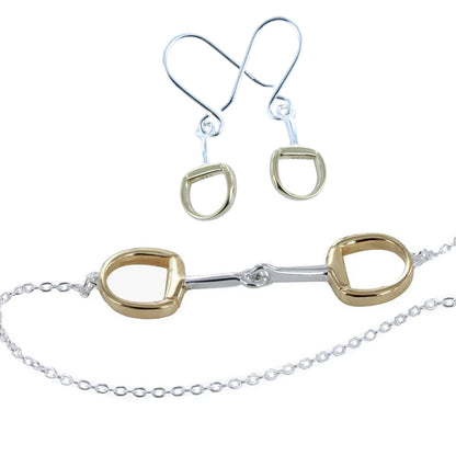A jewellery set featuring a horse bit necklace and matching drop earrings. The horse bit has polished gold-toned rings connected by a silver-toned centre bar and chain, while the matching earrings have silver-toned fishhook wires and gold-toned oval drops.