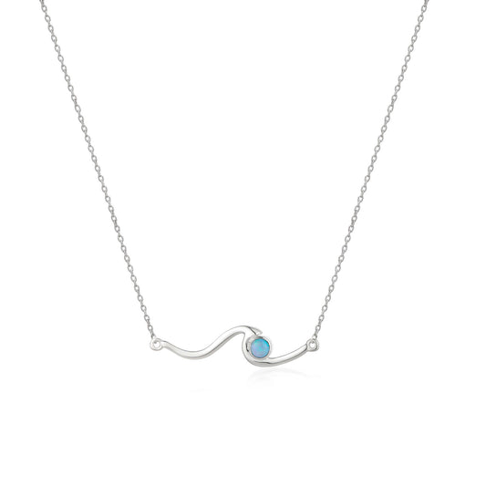 Silver necklace with a blue gemstone on a white background