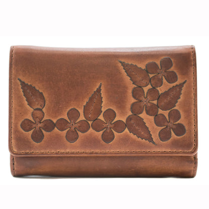 Brown leather wallet with floral embossing on a white background
