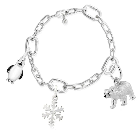 link charm bracelet with polar bear charm, pengion charm and snow flake charm on white background